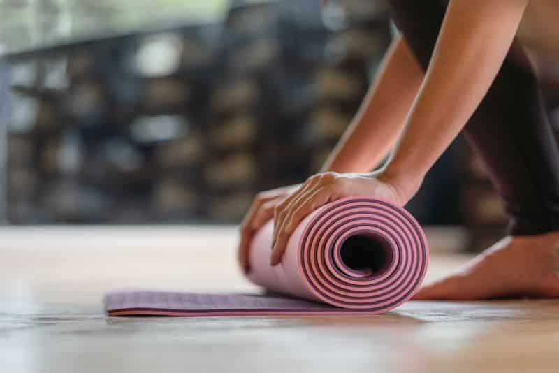 <span  class="uc_style_uc_tiles_grid_image_elementor_uc_items_attribute_title" style="color:#ffffff;">Close-up rolling yoga mat after working out at fitness ,sport and training club.Diversity People Exercise Class Relax Concept</span>